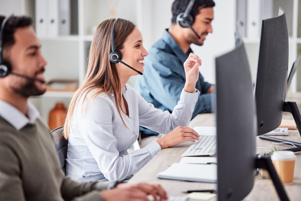 Call center workers looking at computer screens